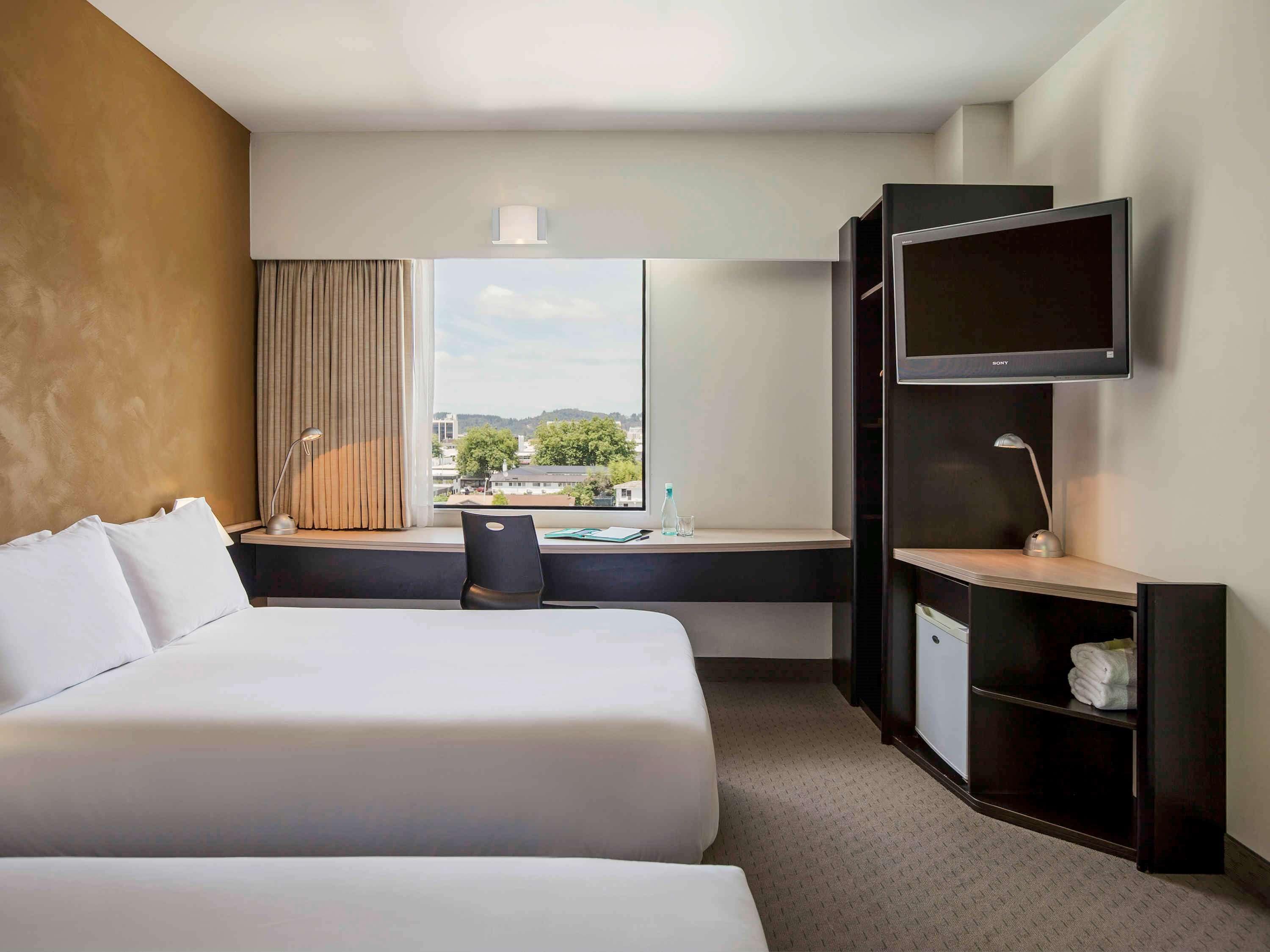 hypo-allergenic bedding, down duvets, desk, blackout curtains