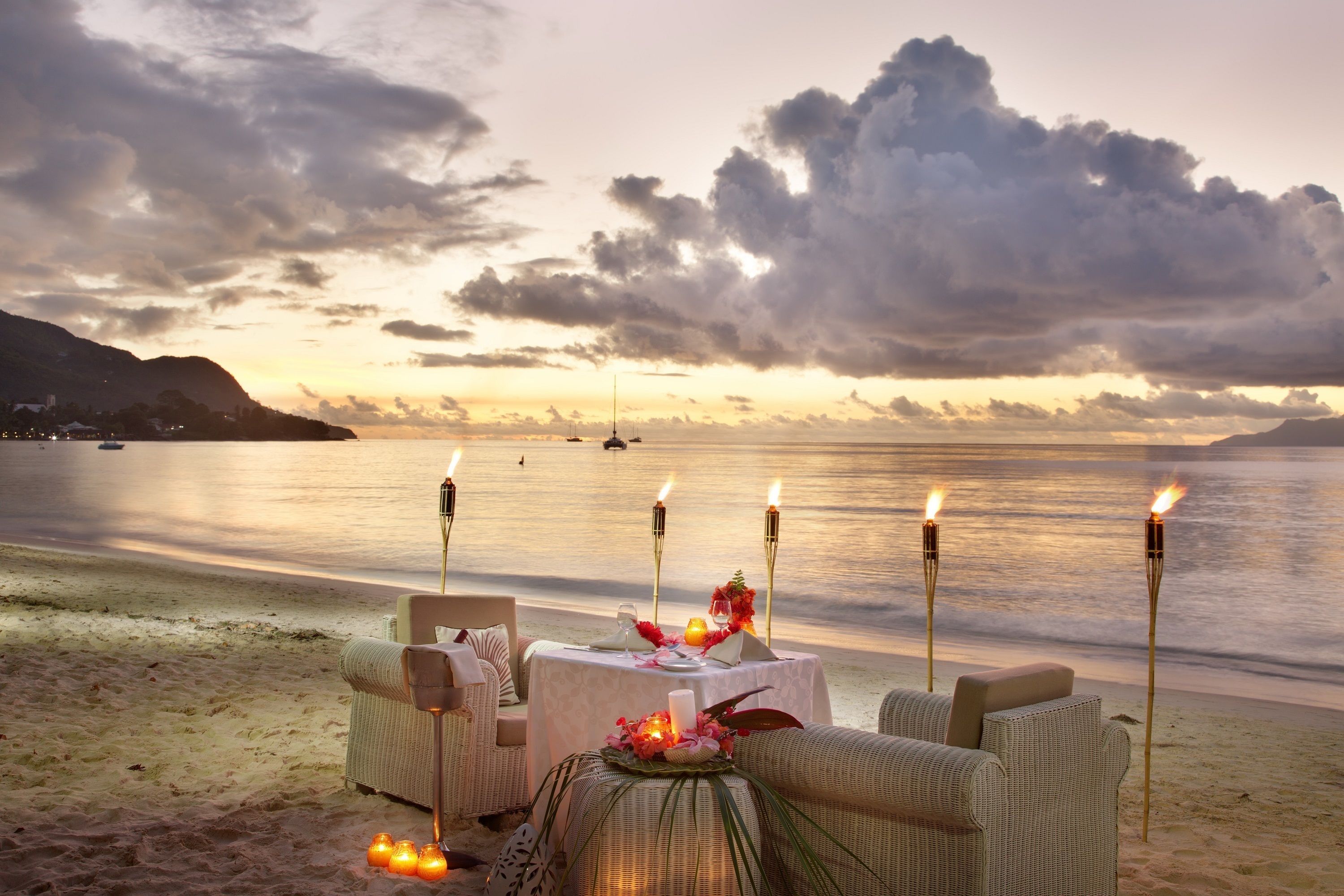On the beach, white sand, sun loungers, beach towels