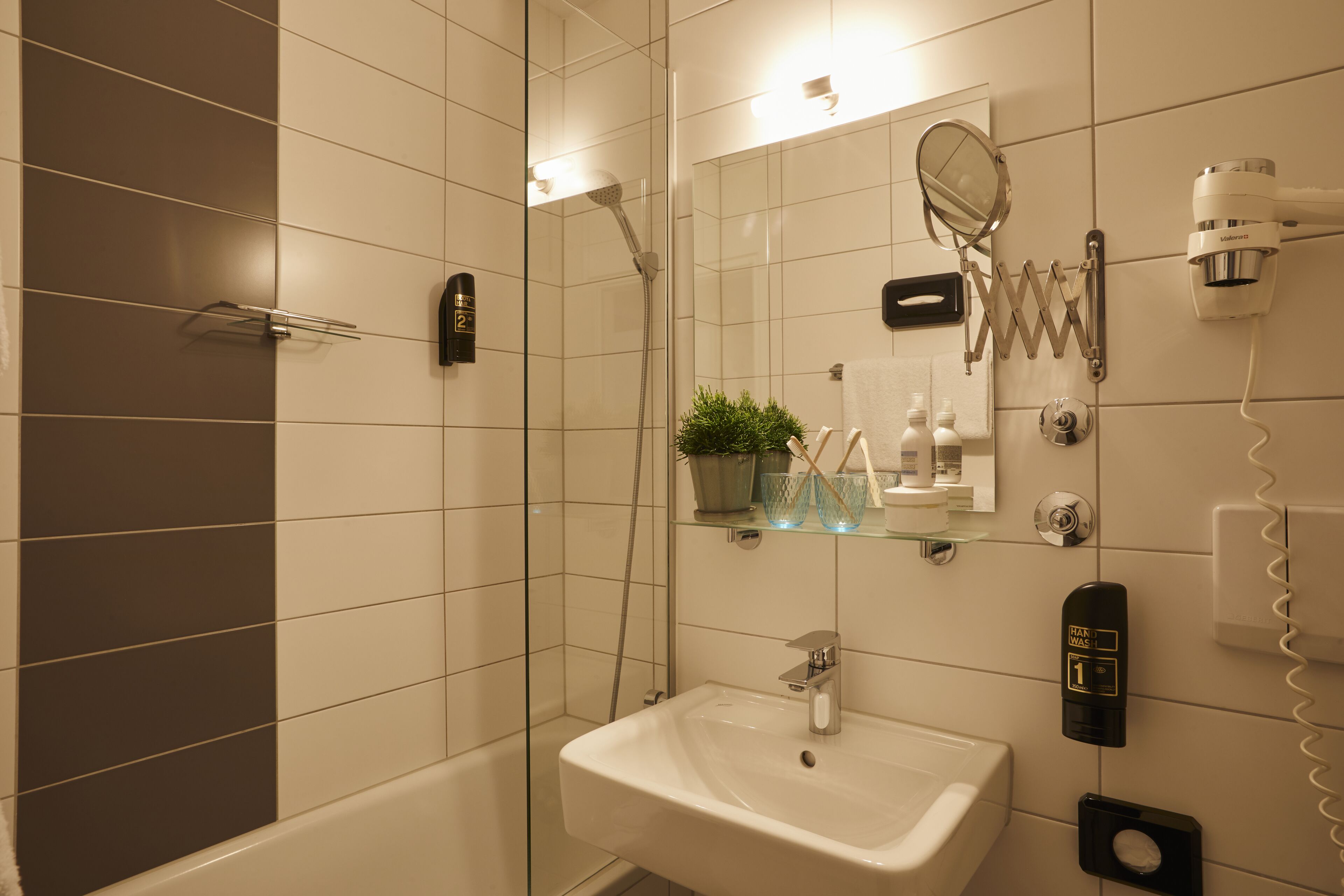 premium double room | bathroom | shower, eco-friendly toiletries, hair dryer, towels