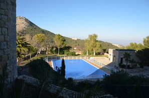 Seasonal outdoor pool, pool umbrellas, pool loungers