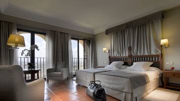 Luxe beddengoed, een minibar, een kluis op de kamer, een bureau