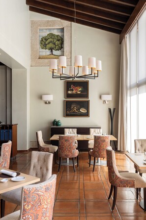 Breakfast, lunch, dinner served; Regional cuisine, garden views 