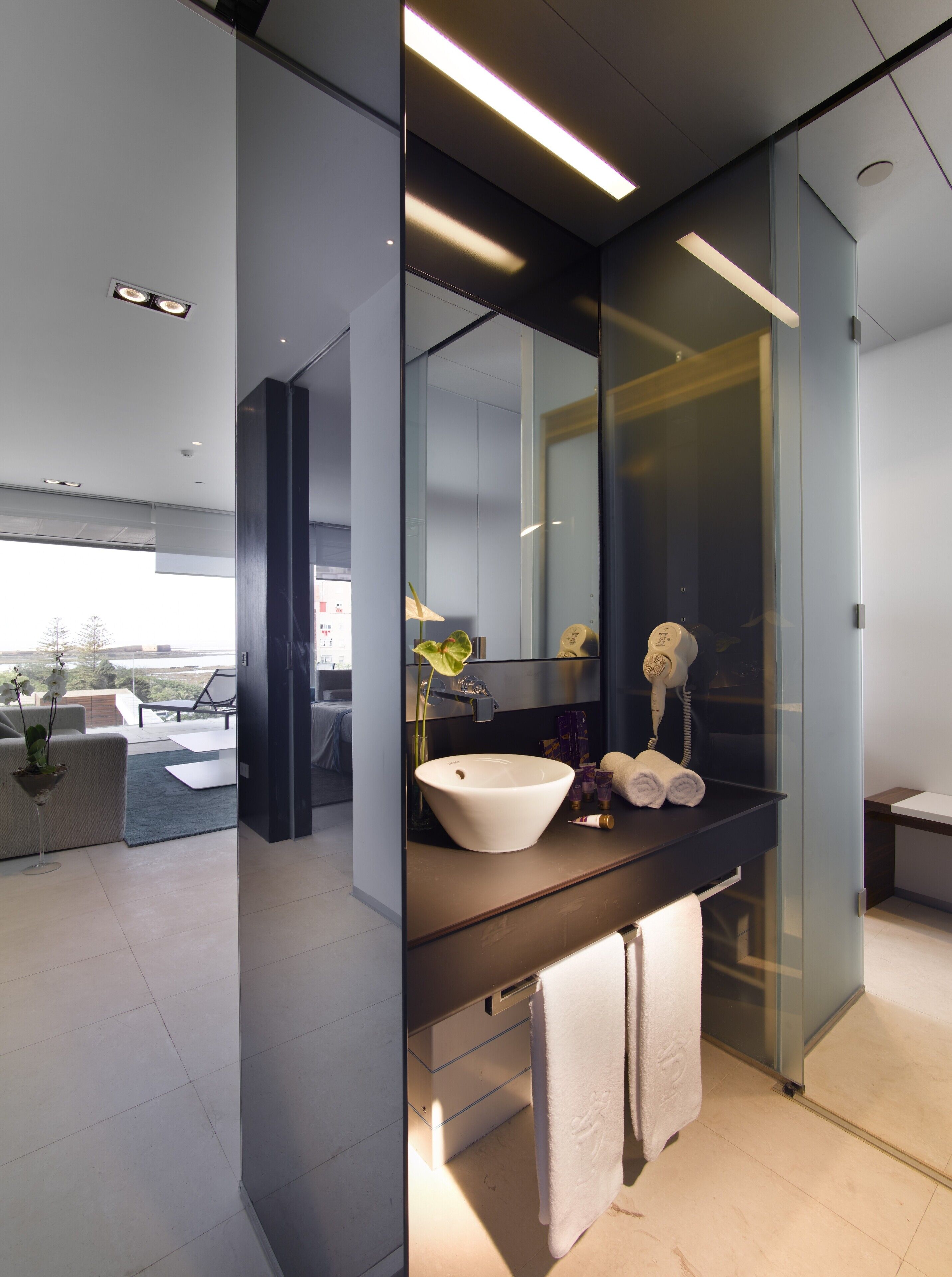 separate bathtub and shower, hair dryer, slippers, bidet