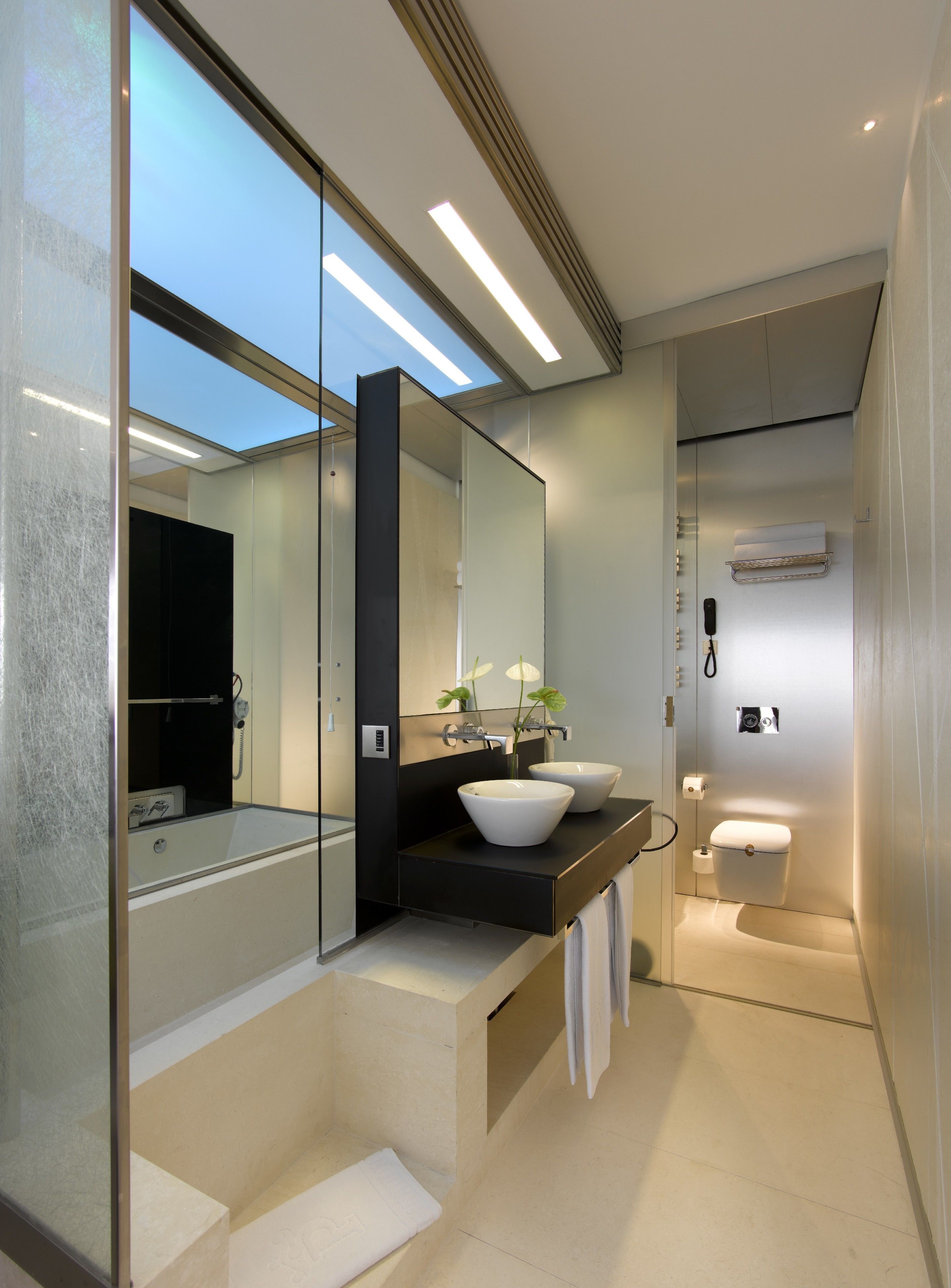 separate bathtub and shower, hair dryer, slippers, bidet