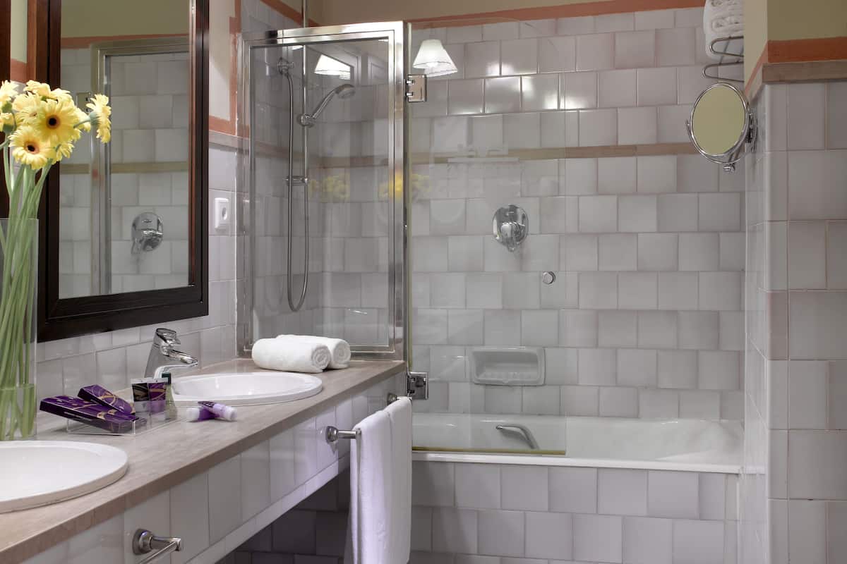 designer toiletries, hair dryer, bidet, towels