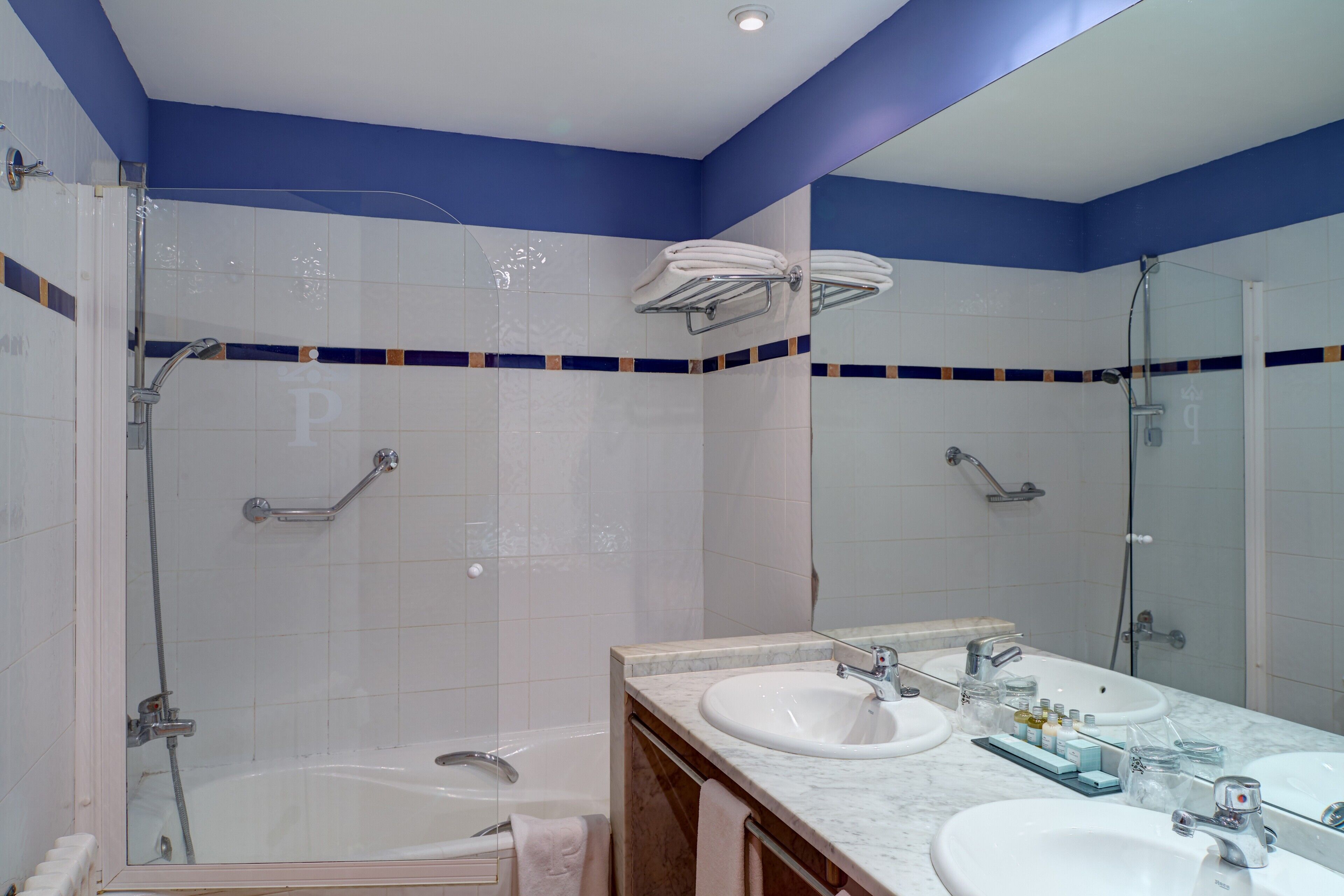 combined shower/bathtub, hair dryer, towels, soap