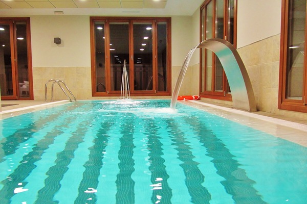 Indoor pool, seasonal outdoor pool, open noon to 8:00 PM, pool umbrellas