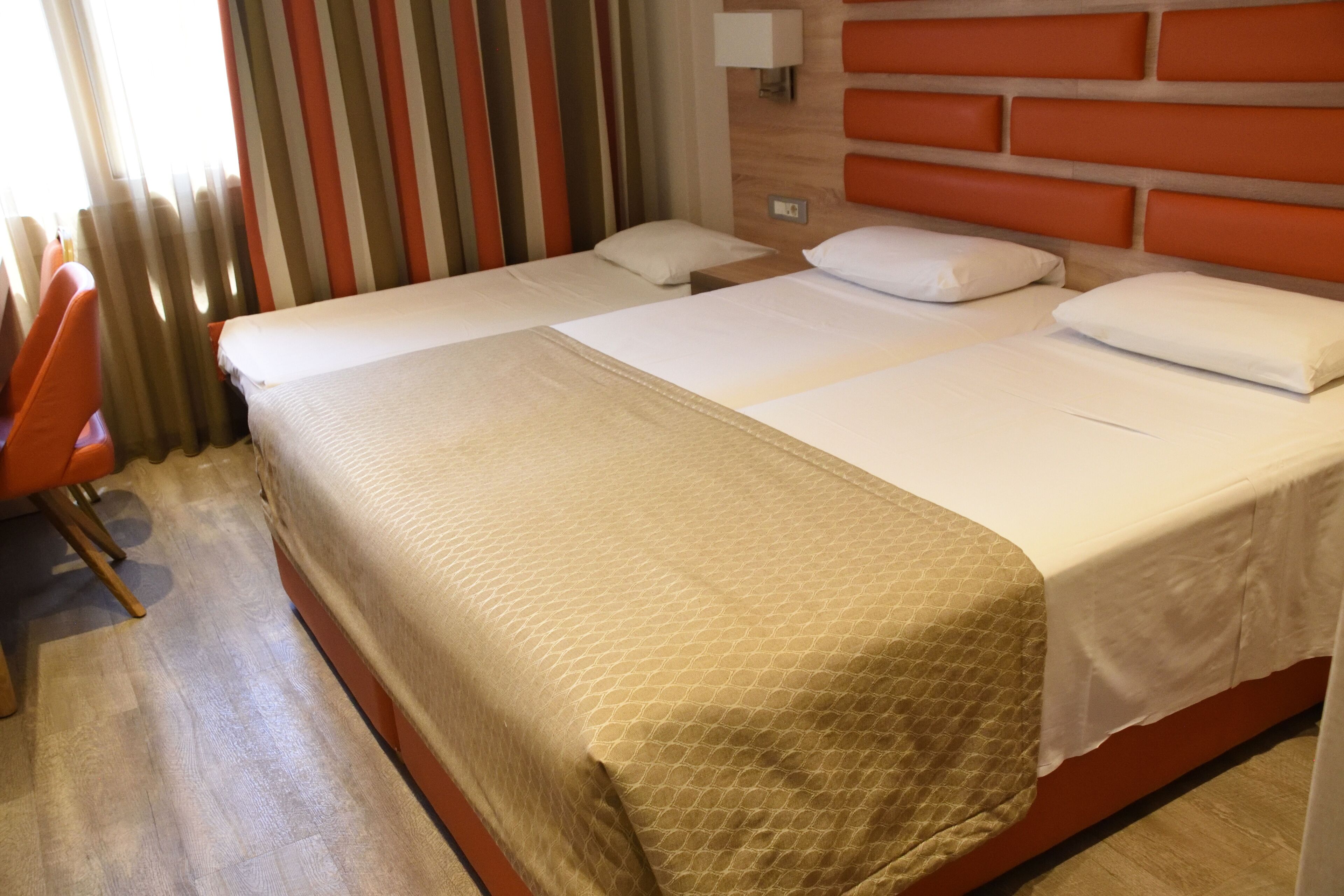 triple room | minibar, in-room safe, desk, blackout curtains