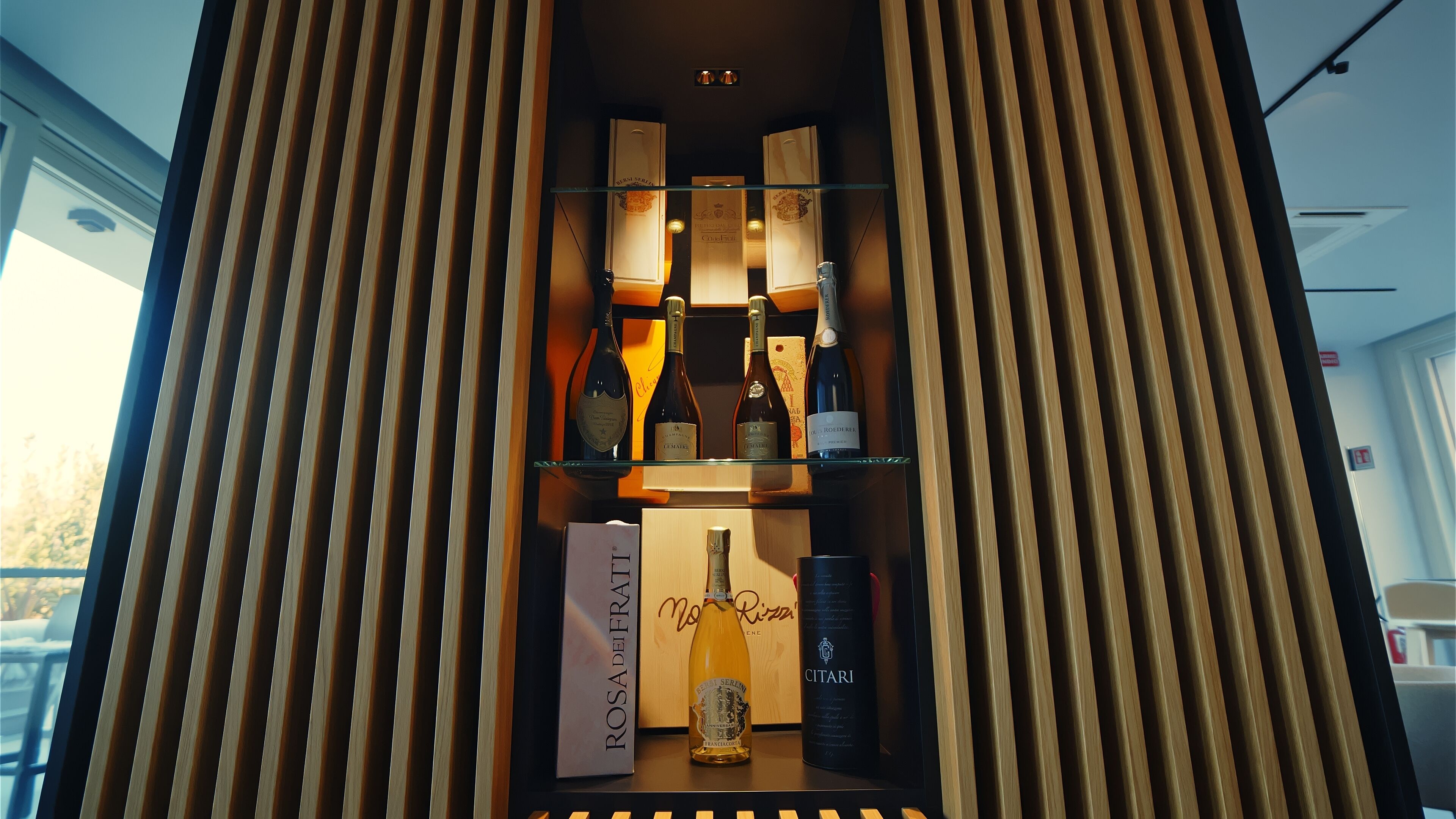 A wine display with bottles and a branded box.