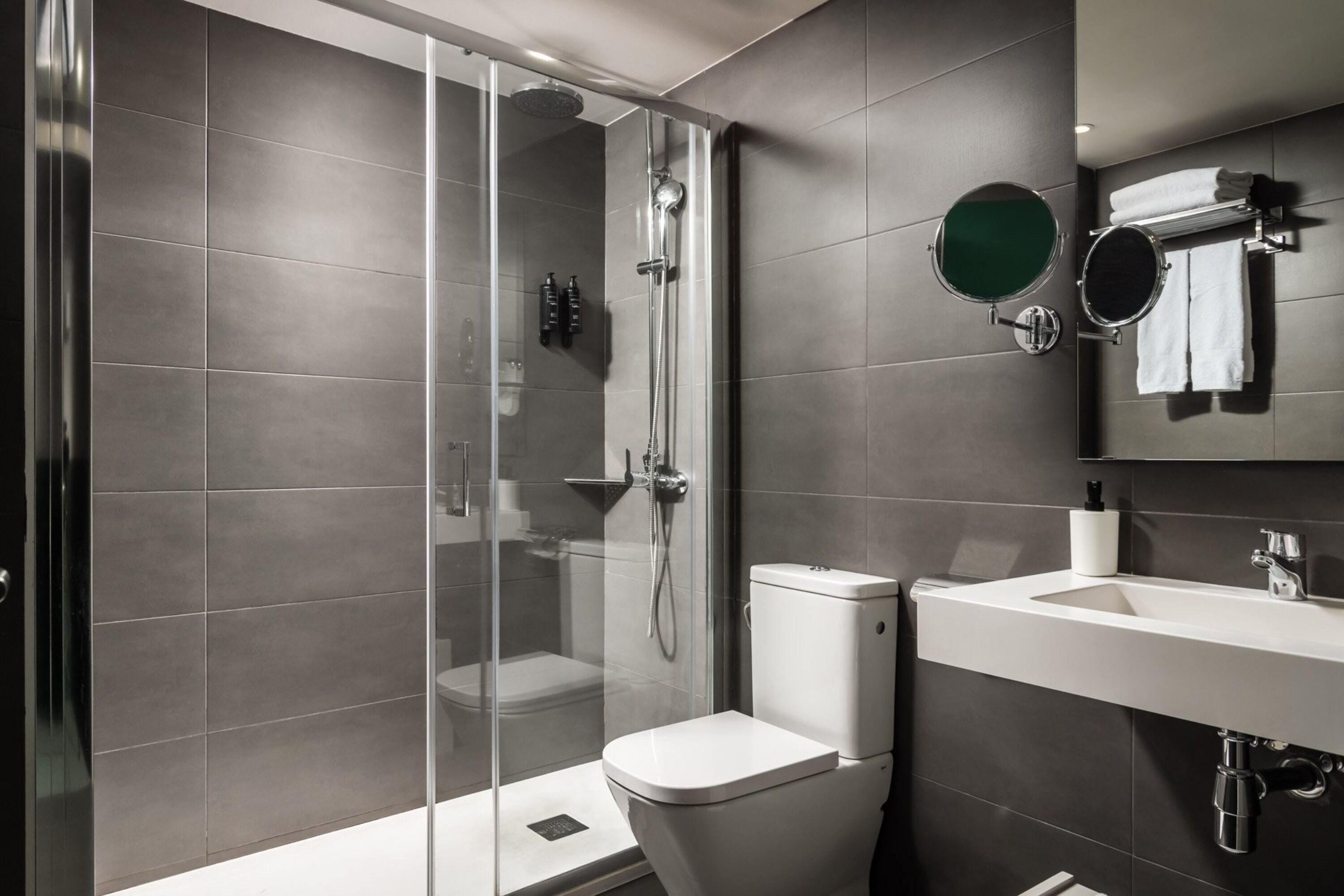superior double room | bathroom | shower, hair dryer, towels, soap