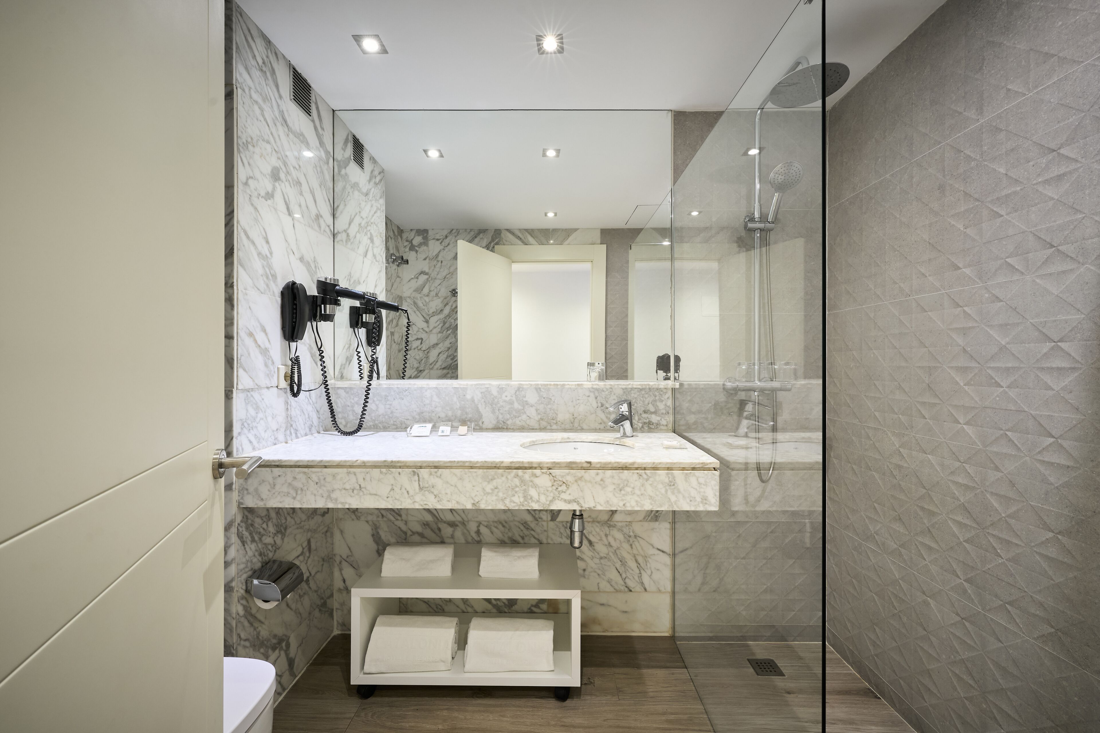 eco-friendly toiletries, hair dryer, towels