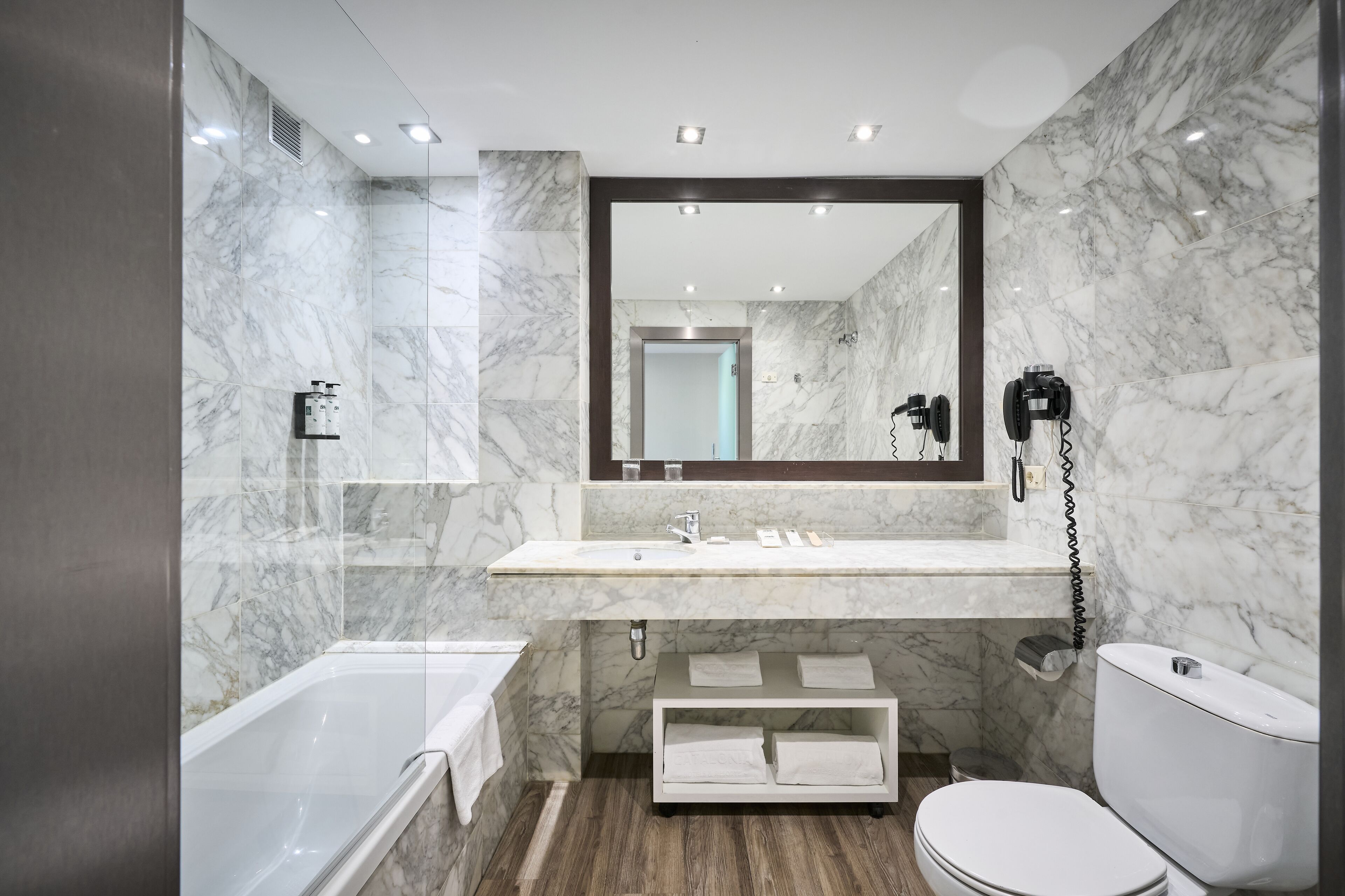 eco-friendly toiletries, hair dryer, towels