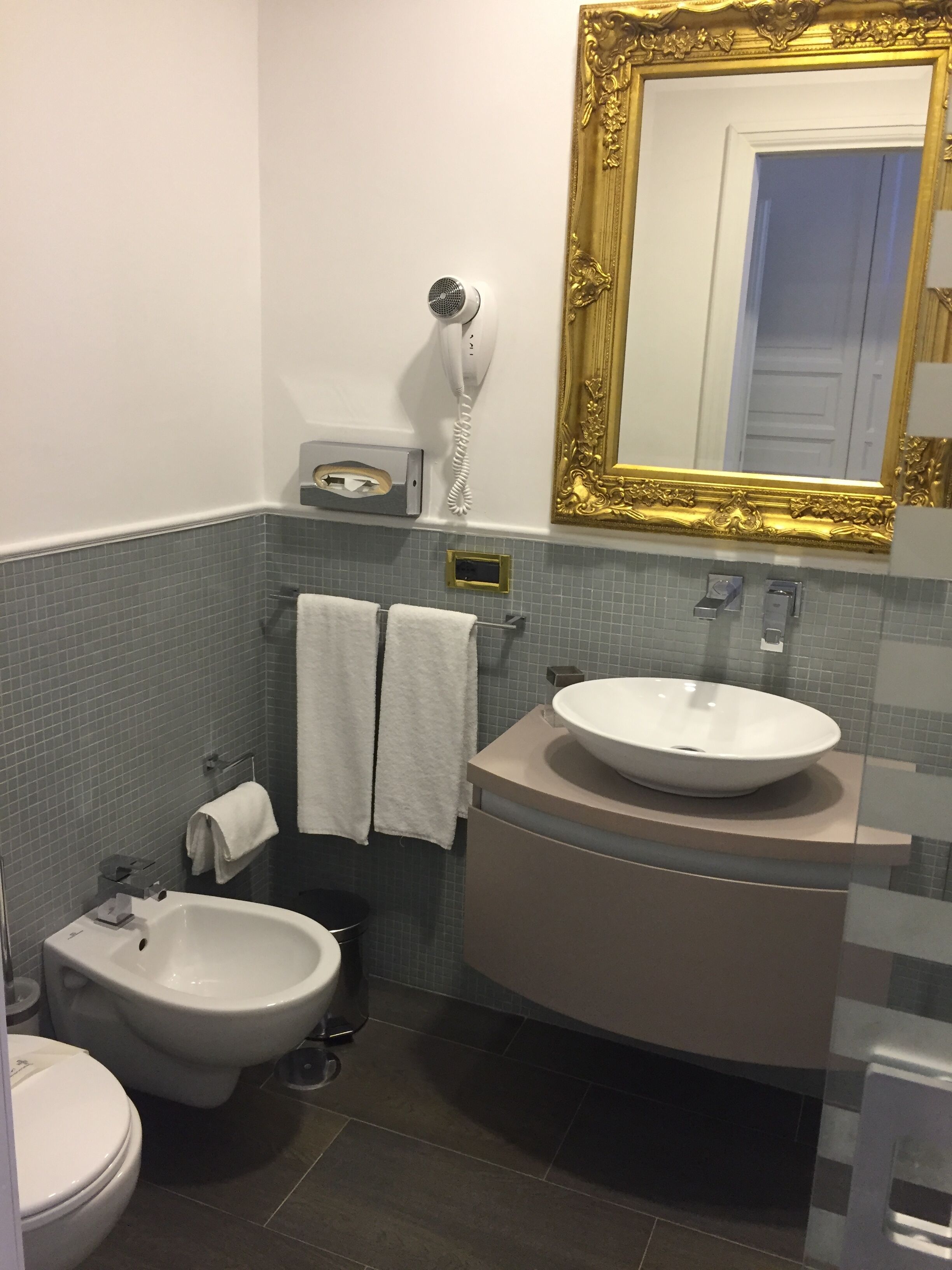 deep-soaking bathtub, rainfall showerhead, designer toiletries