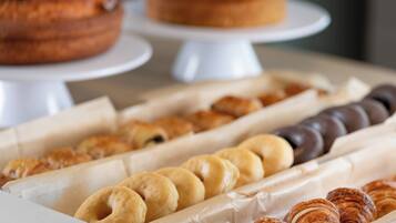A variety of pastries displayed in a bakery setting.