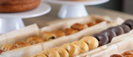 A variety of pastries displayed in a bakery setting.