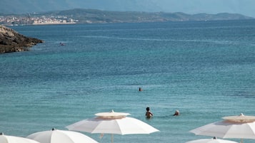 Private beach, white sand, sun-loungers, beach umbrellas