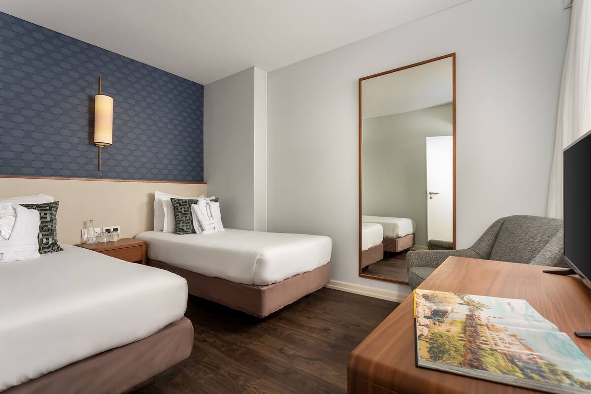 family room, city view | 1 bedroom, minibar, in-room safe, desk