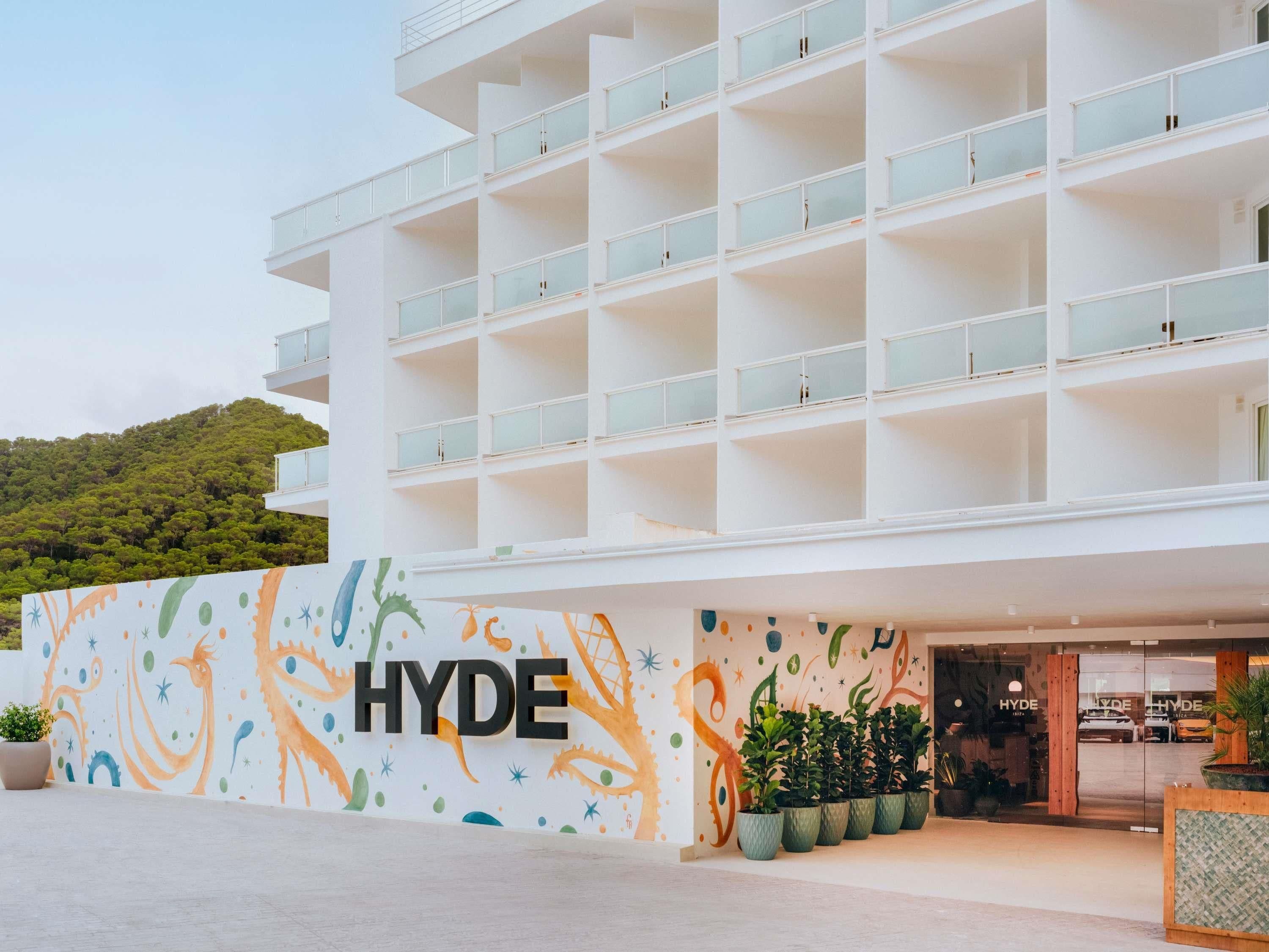 A multi-story hotel with a modern design, featuring a prominent 'HYDE' sign on the facade.
