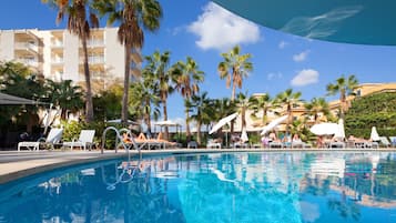 Indoor pool, pool umbrellas, pool loungers