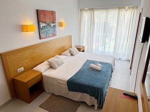 Triple Room, Balcony (Free Beach Shuttle) | Desk, blackout drapes, free WiFi, bed sheets