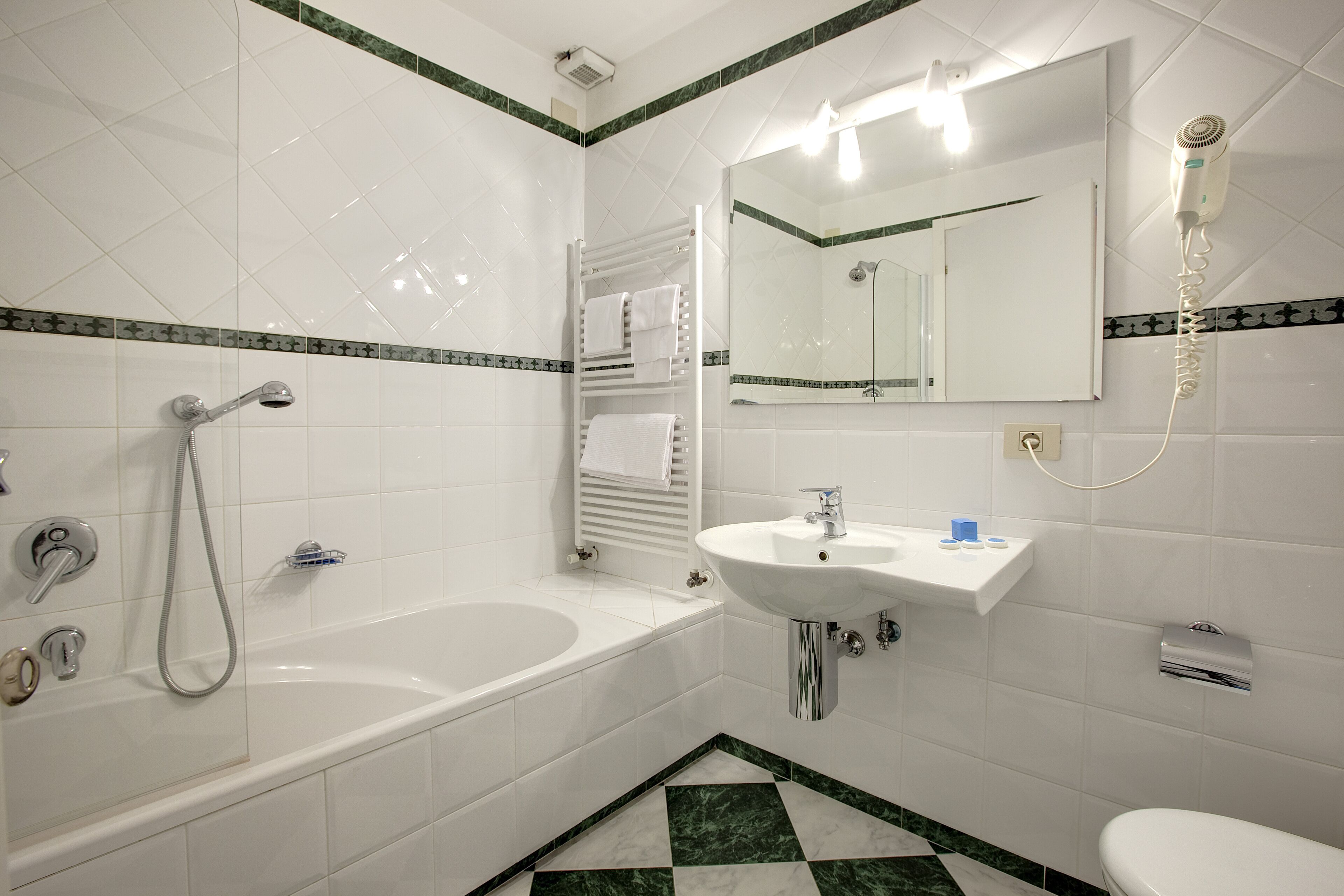 family studio suite | bathroom | hair dryer, bidet, towels, soap