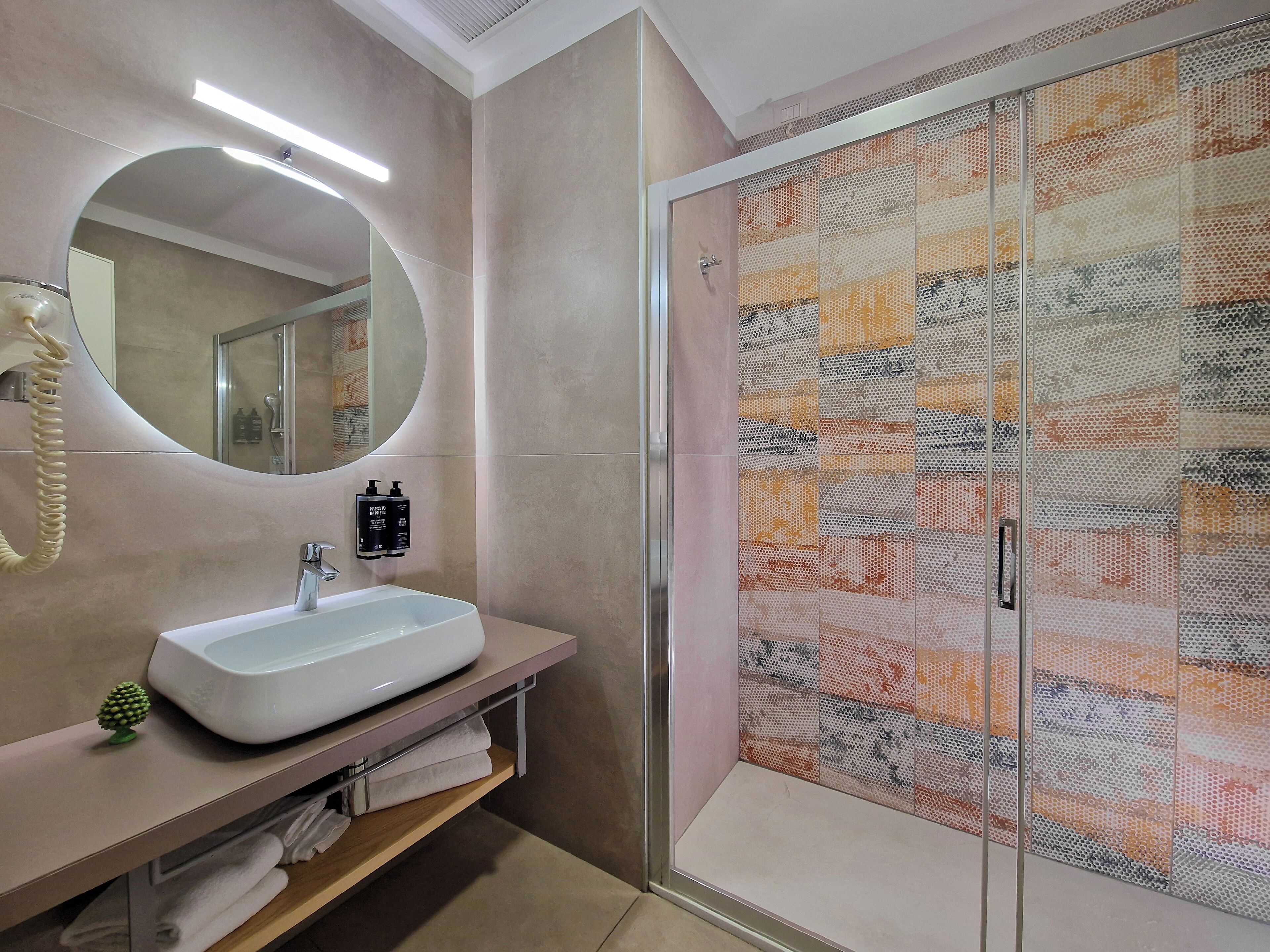 shower, eco-friendly toiletries, hair dryer, slippers