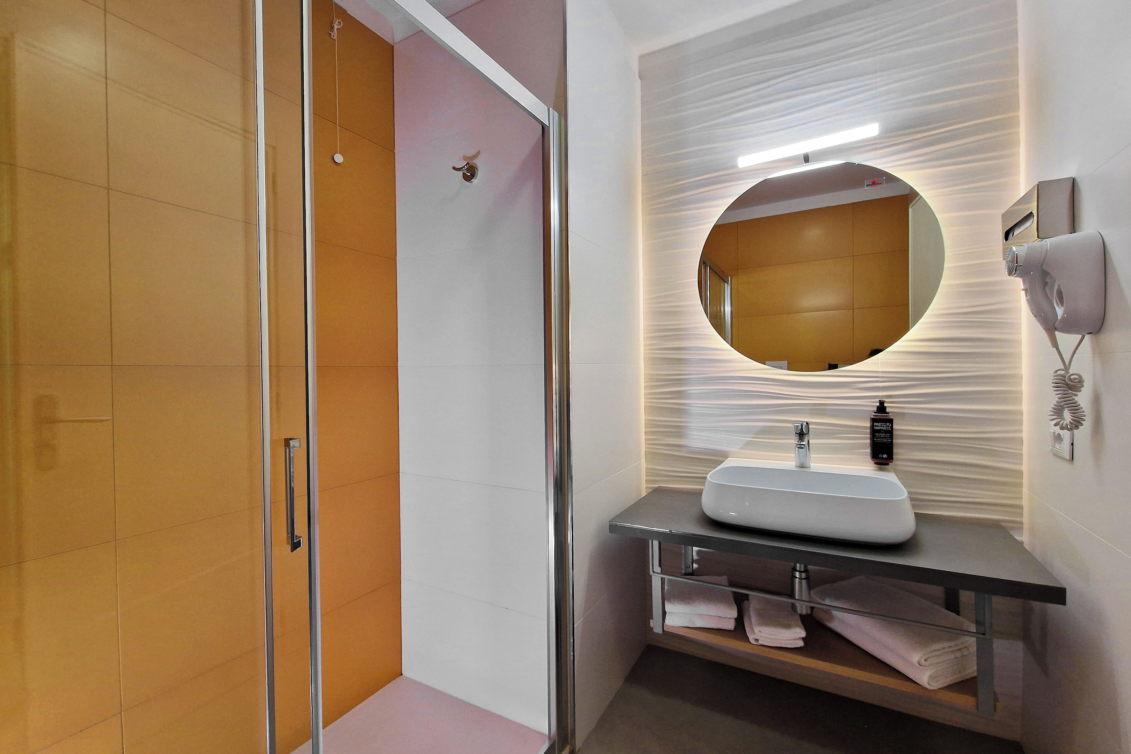 shower, eco-friendly toiletries, hair dryer, slippers