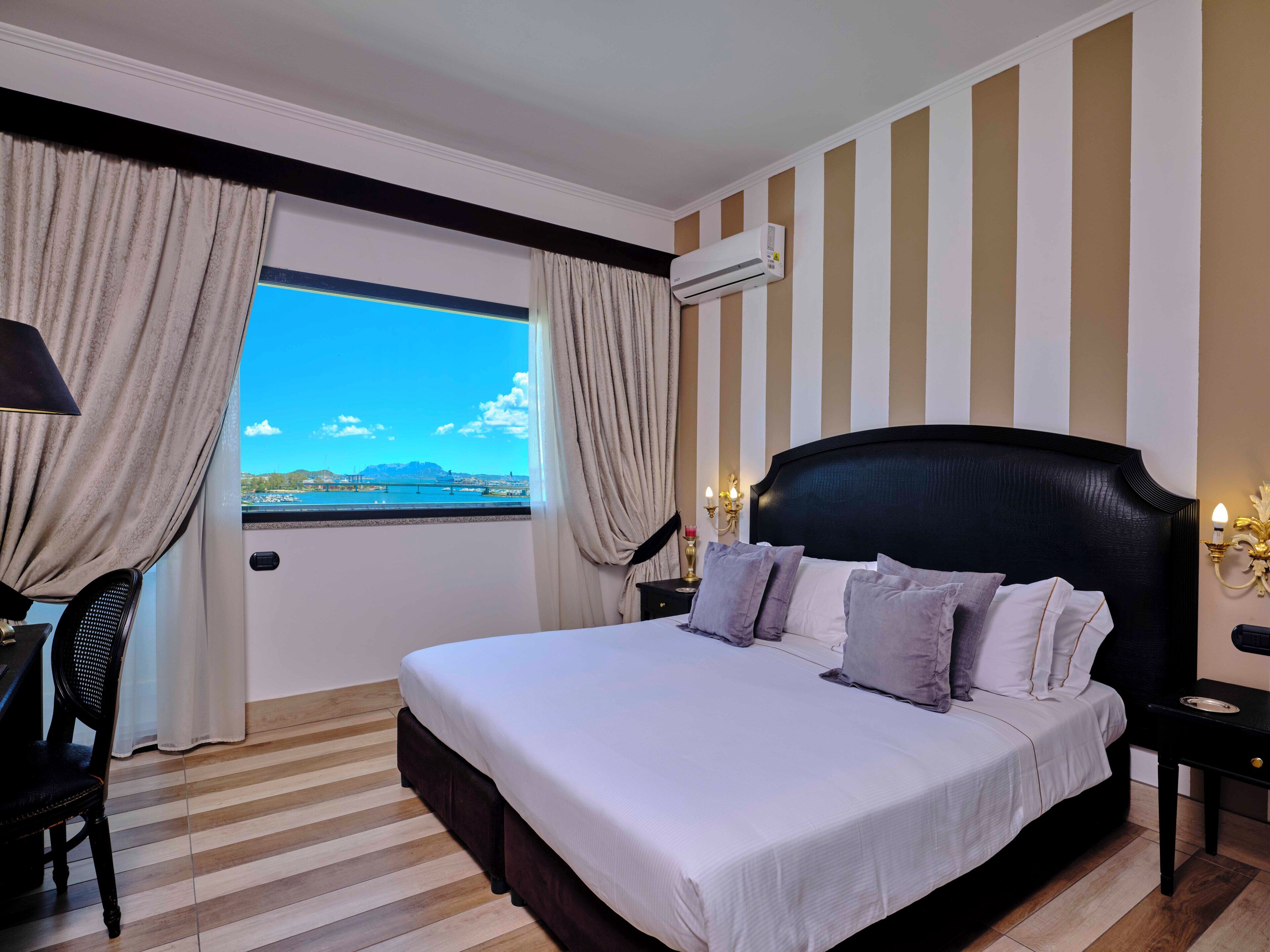 Hypo-allergenic bedding, down comforters, minibar, in-room safe