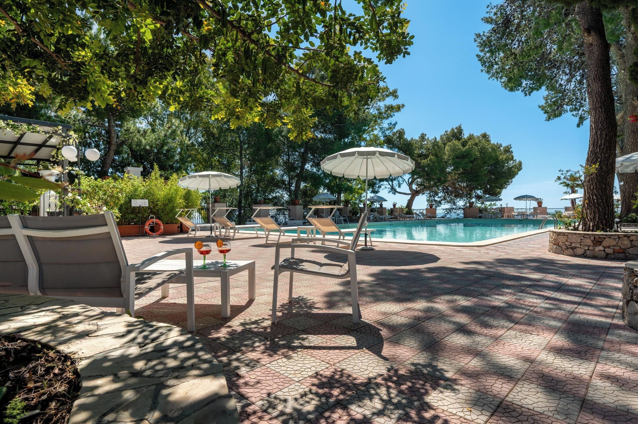 outdoor pool, pool umbrellas, pool loungers