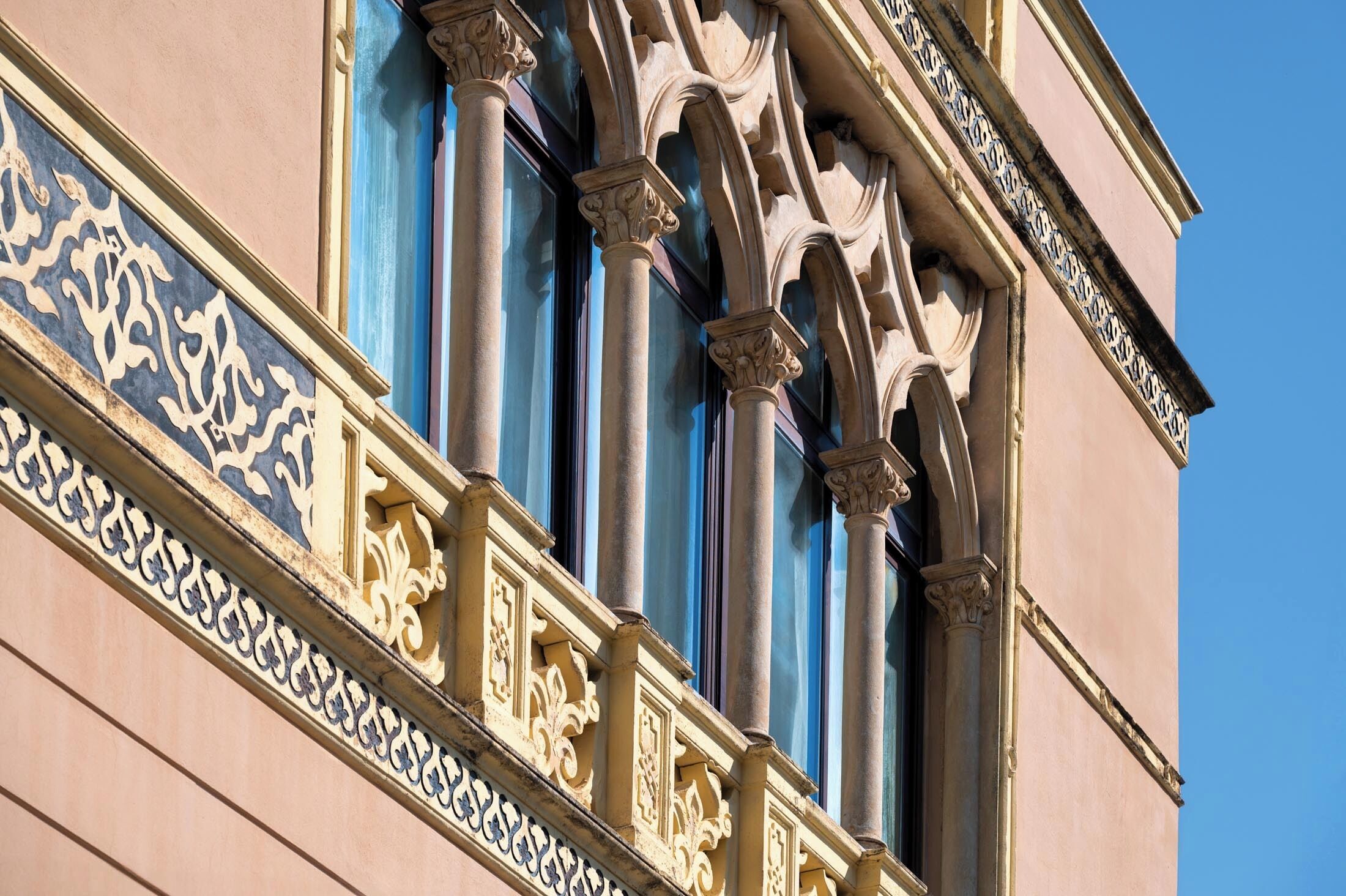 A building facade with ornate architectural details, including columns and decorative moldings.