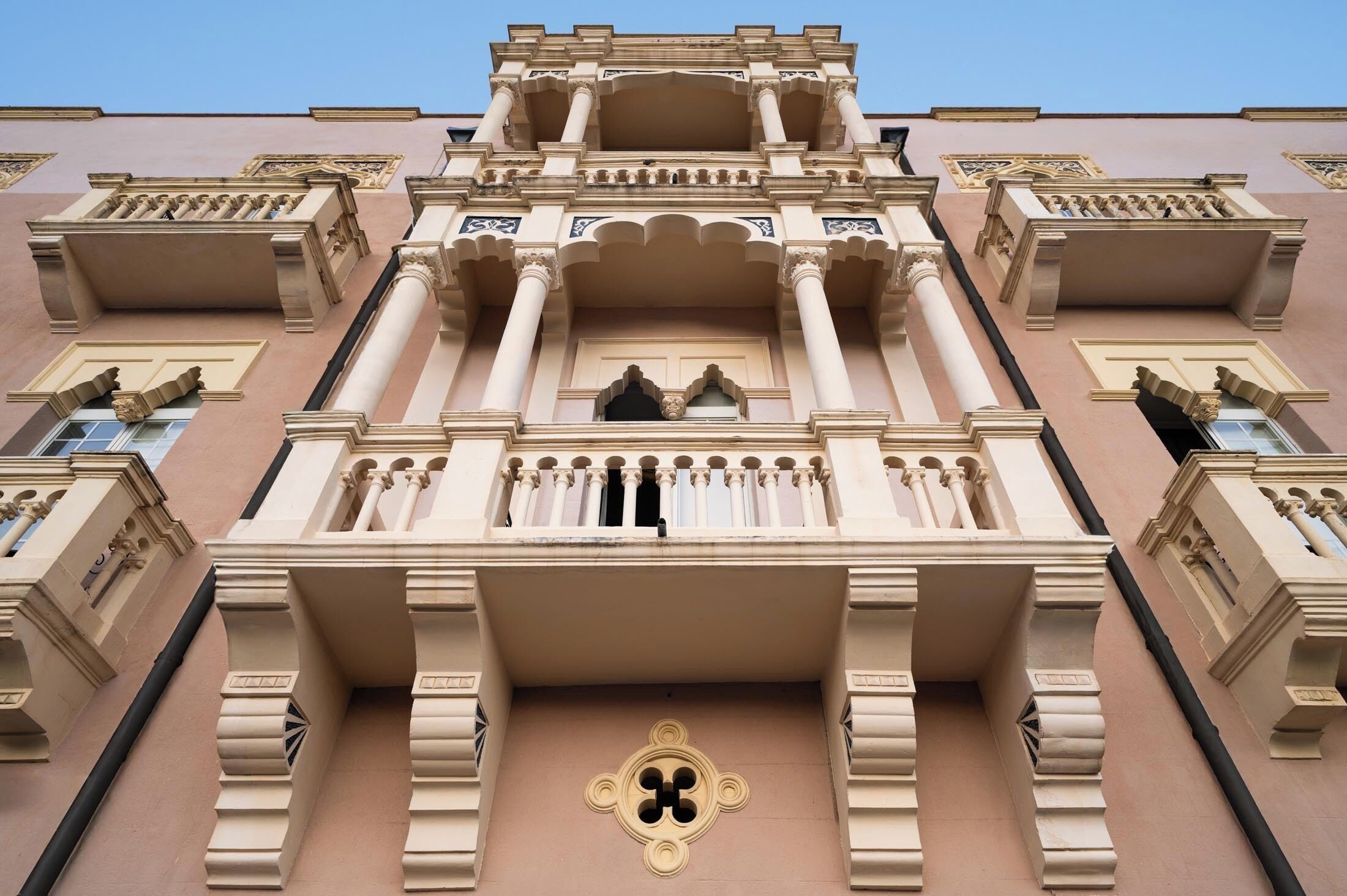 A building with ornate architectural details, including columns, arches, and decorative moldings.
