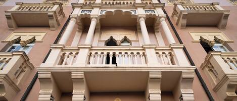 A building with ornate architectural details, including columns, arches, and decorative moldings.