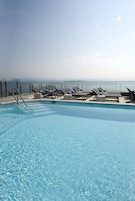 Outdoor pool, pool umbrellas, pool loungers