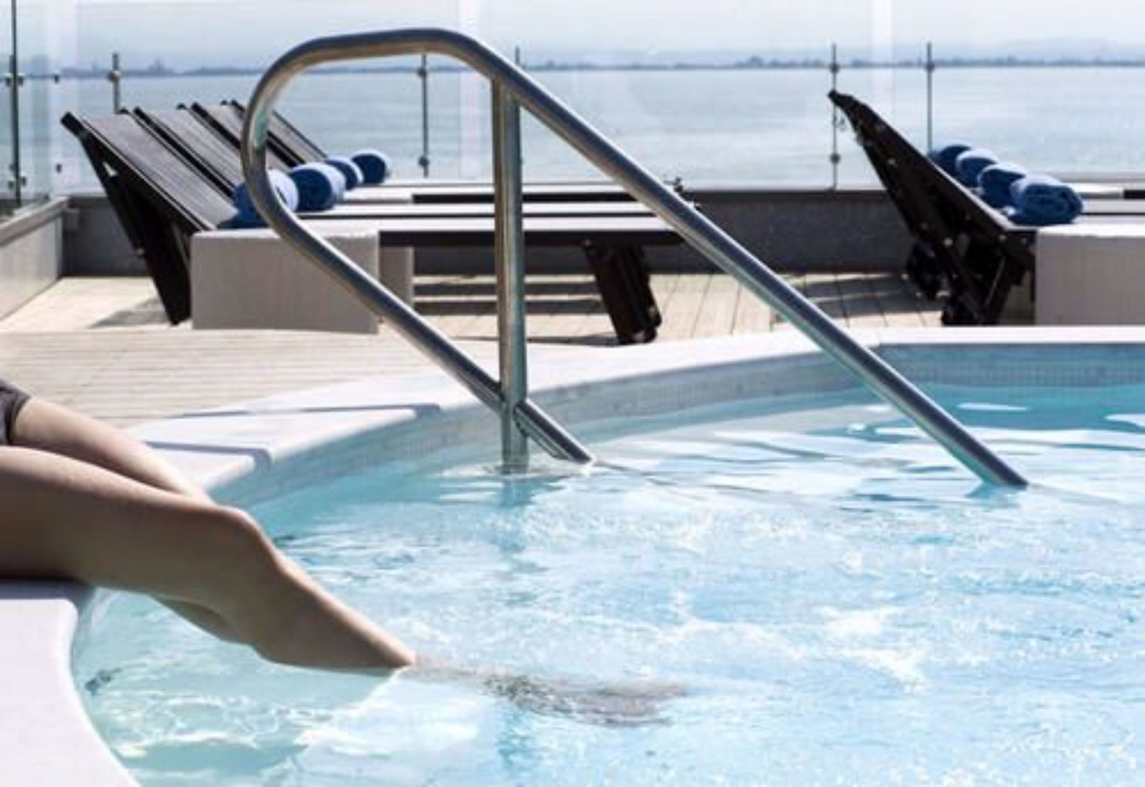 outdoor pool, pool umbrellas, pool loungers