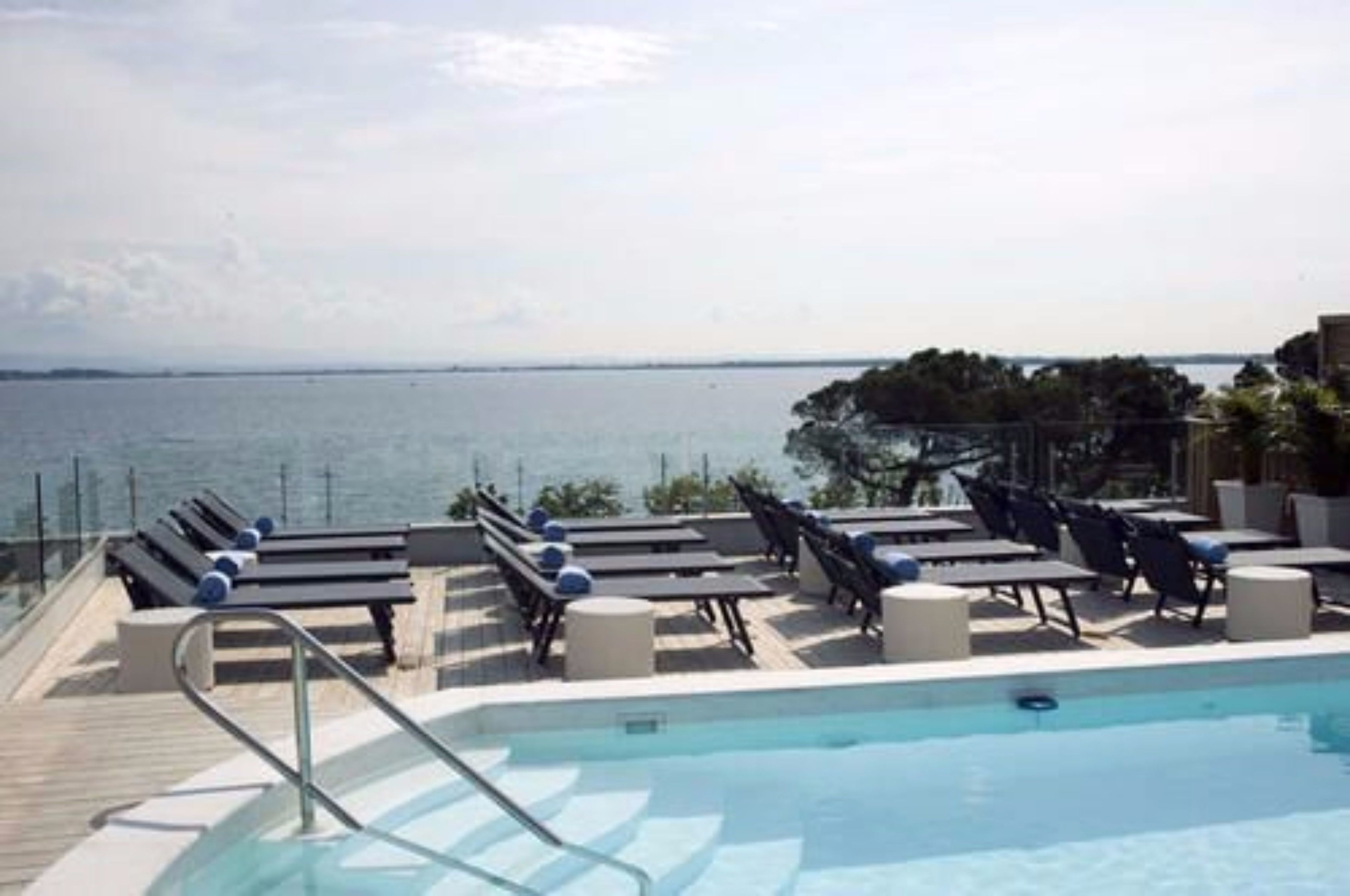 outdoor pool, pool umbrellas, pool loungers