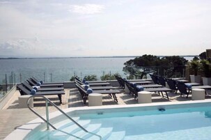 Outdoor pool, pool umbrellas, pool loungers