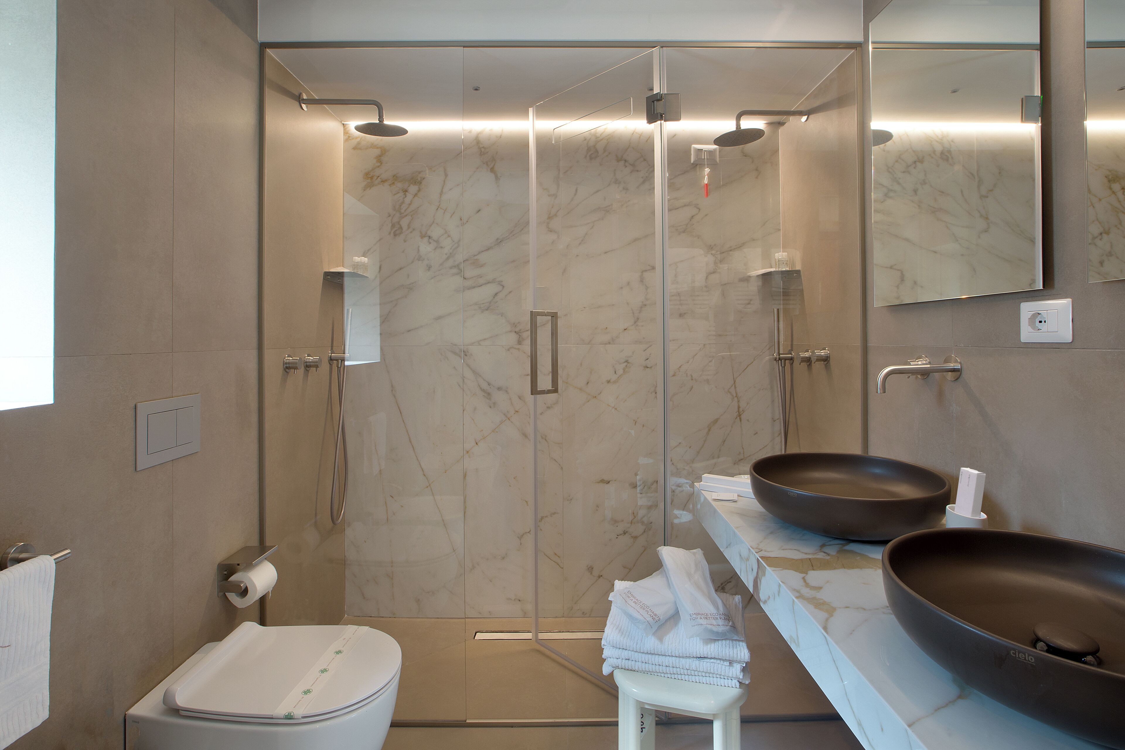 deluxe duplex | bathroom | shower, rainfall showerhead, free toiletries, hair dryer
