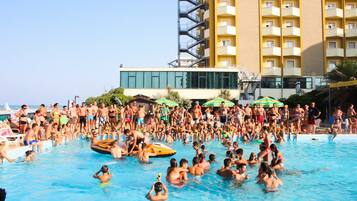 Seasonal outdoor pool, open 9:00 AM to 7:00 PM, pool umbrellas