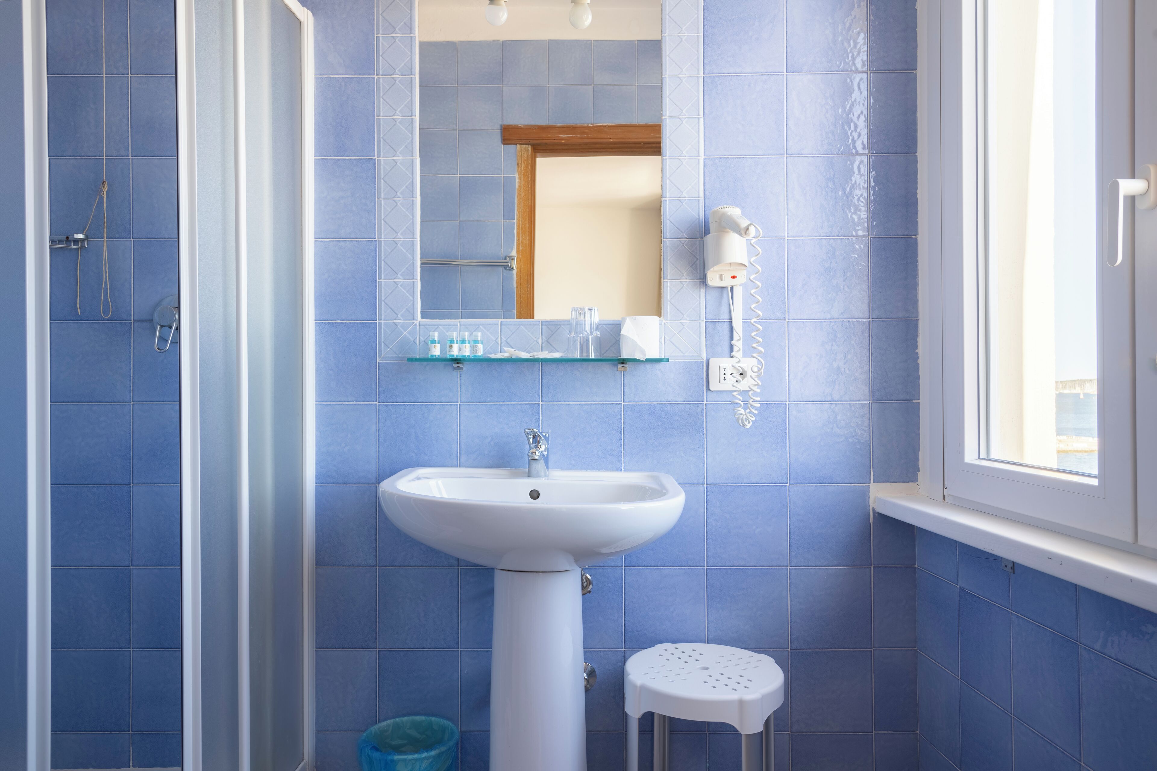 deep-soaking bathtub, rainfall showerhead, free toiletries, hair dryer