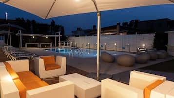 Outdoor pool, open 8 AM to 7 PM, pool umbrellas, pool loungers