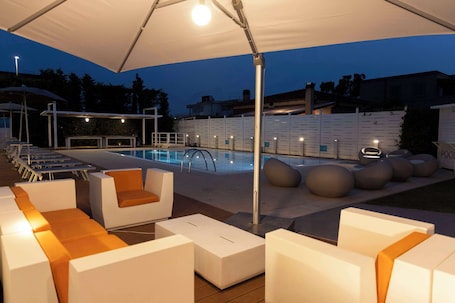 Outdoor pool, open 8 AM to 7 PM, pool umbrellas, sun loungers