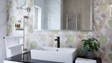 Shower, hair dryer, slippers, towels