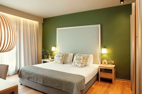 Suite, 1 King Bed | Minibar, in-room safe, desk, laptop workspace