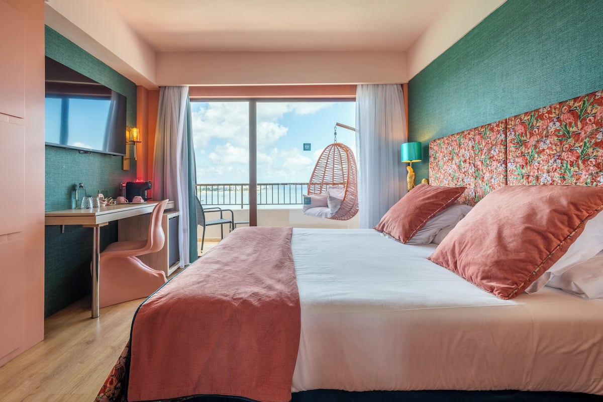 Deluxe Triple Room, Sea View | Minibar, in-room safe, desk, free WiFi