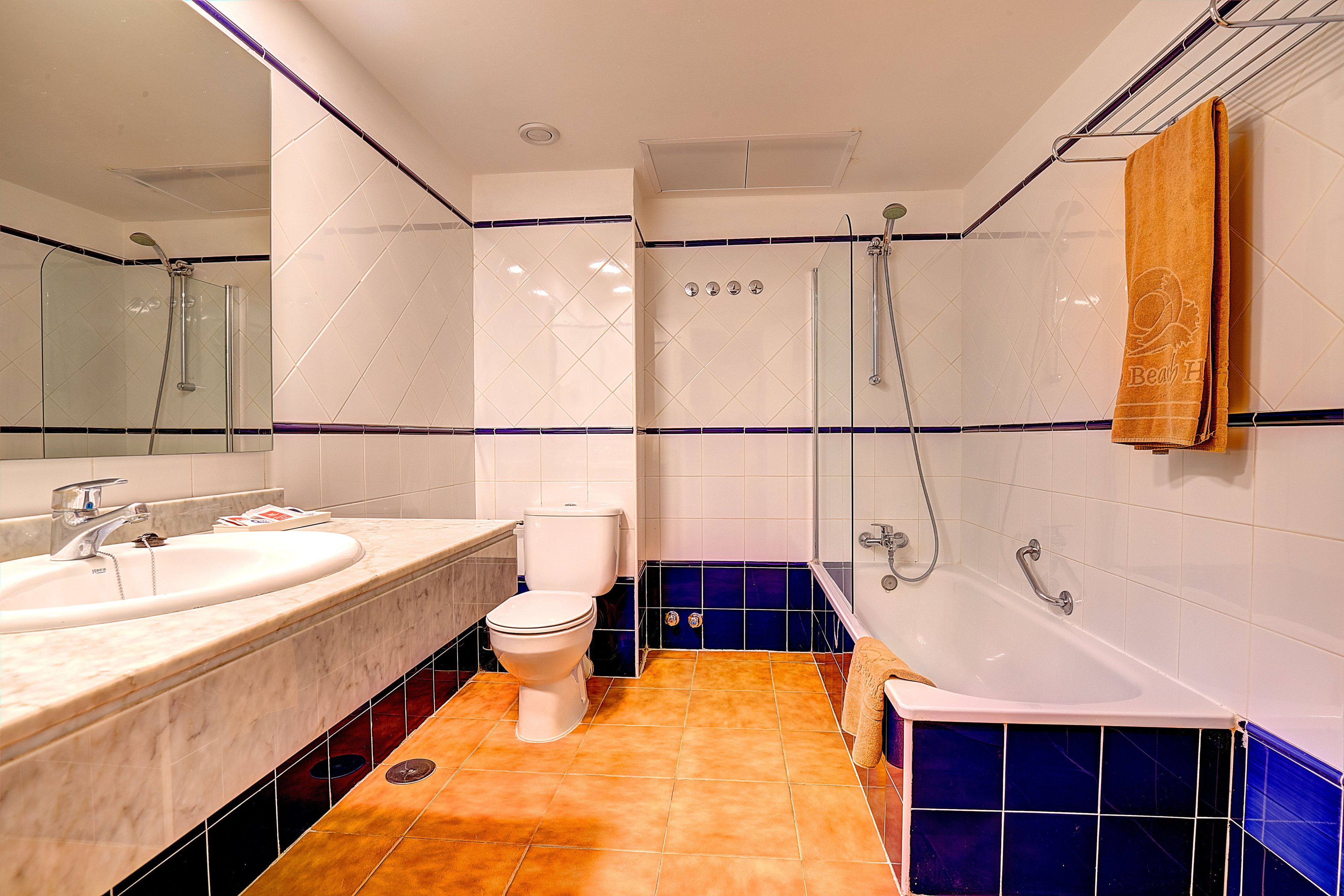 bathtub, hair dryer, towels