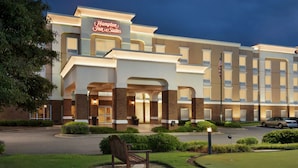 A Hampton Inn & Suites hotel with a well-lit entrance, a parking lot, and a golf course area. - Hampton Inn & Suites Montgomery-EastChase (Montgomery)