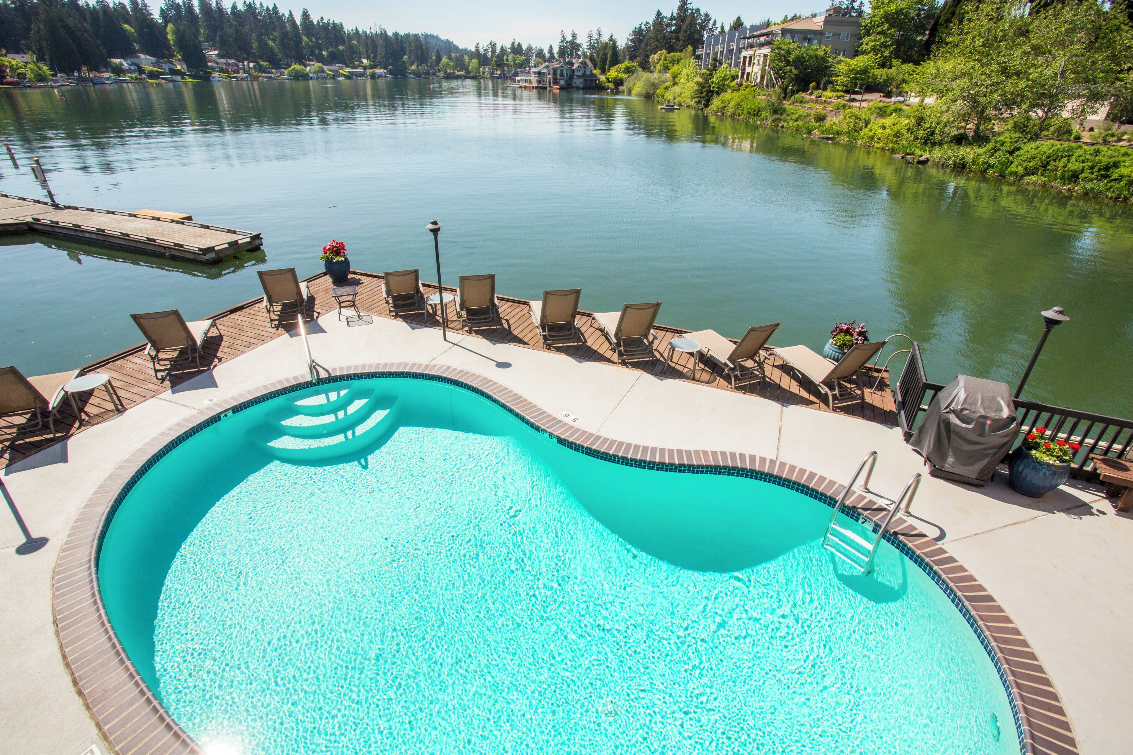 Outdoor pool, open 10:00 AM to 10:00 PM, pool loungers