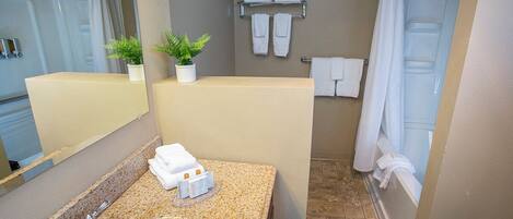 A bathroom with a sink, mirror, towel rack, and shower curtain.