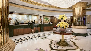 A luxurious lobby with a grand chandelier, marble flooring, and a reception desk. - Windsor Plaza Hotel (Ho Chi Minh City)