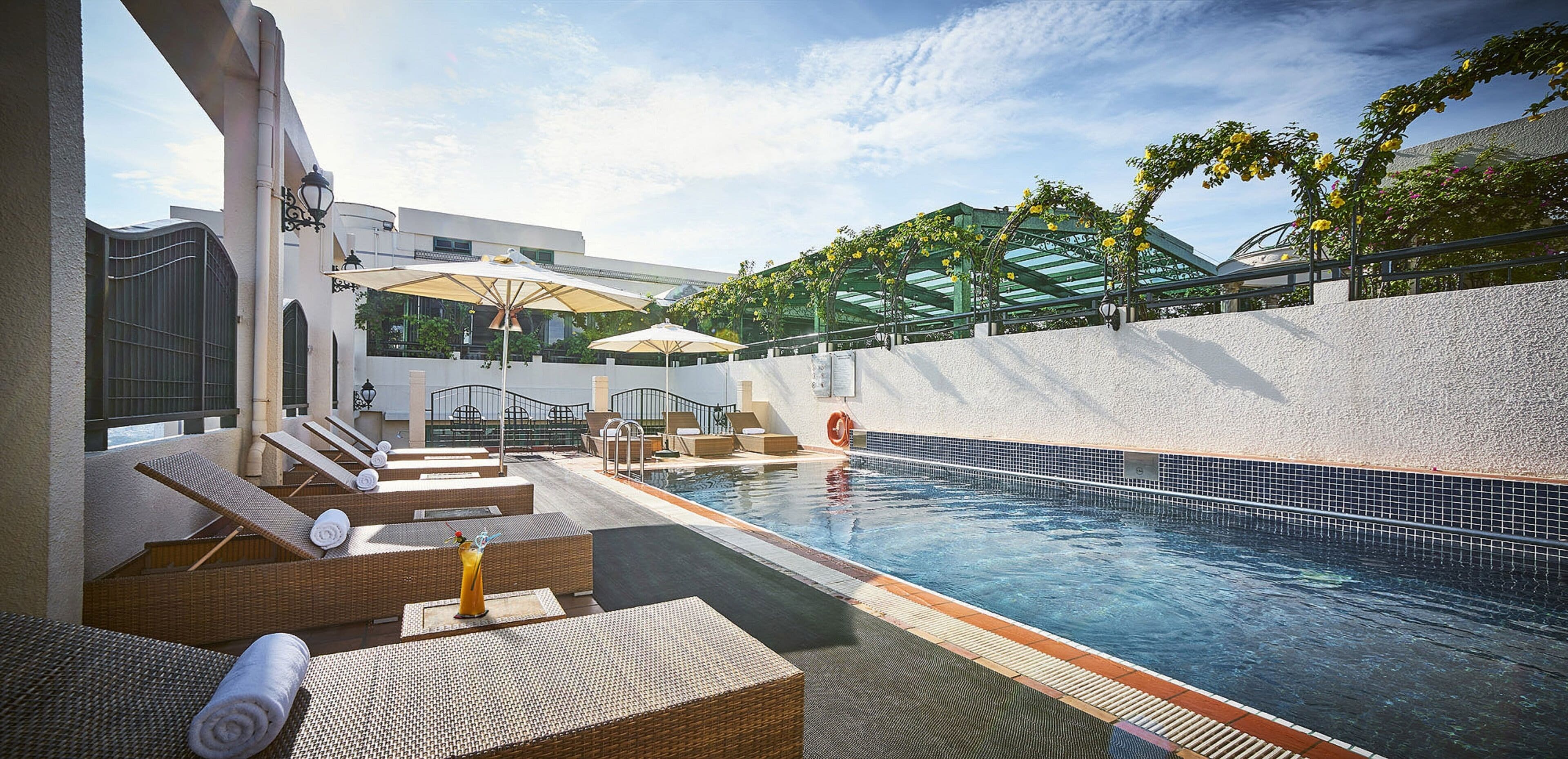 outdoor pool, open 6:00 am to 9:00 pm, pool umbrellas, pool loungers